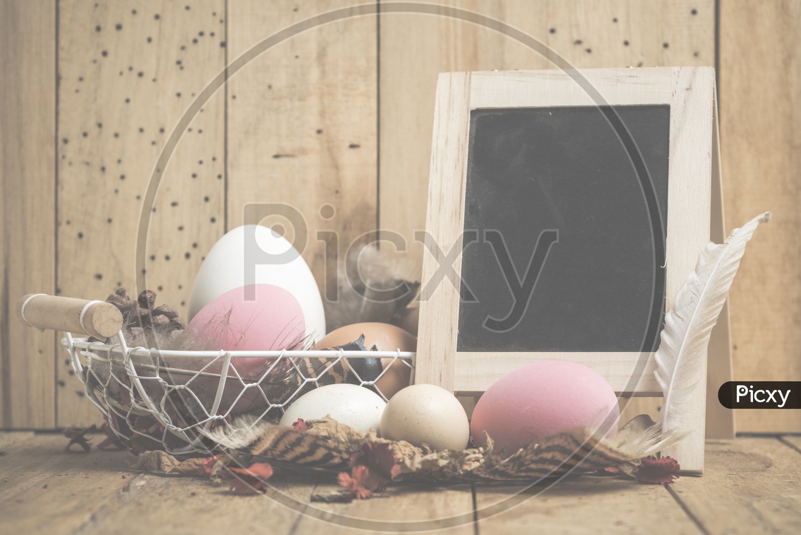 Easter concept with eggs on a wooden background With Vintage Filter