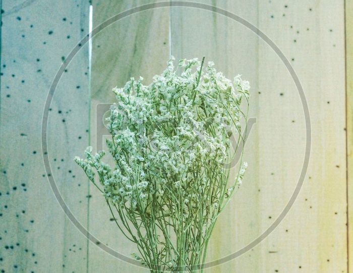 Baby Breath Flowers Over Wooden Background With Colour Palate Filter