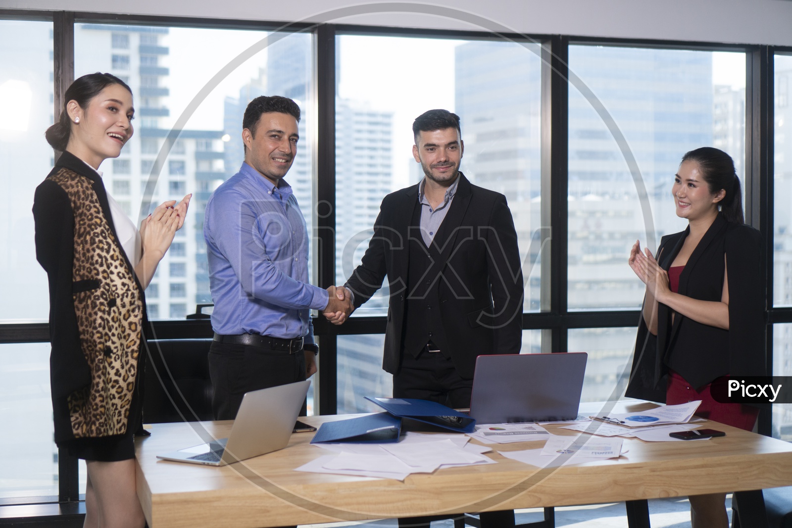 Business Deals or Businessmen Shaking Hands In a Meeting