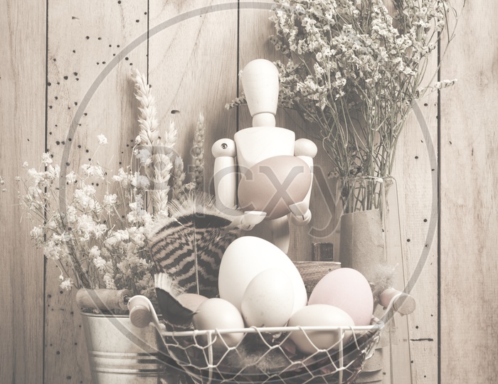 Easter concept with eggs on a wooden background with vintage filter