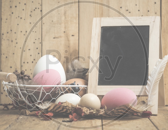 Easter concept with eggs on a wooden background With Vintage Filter