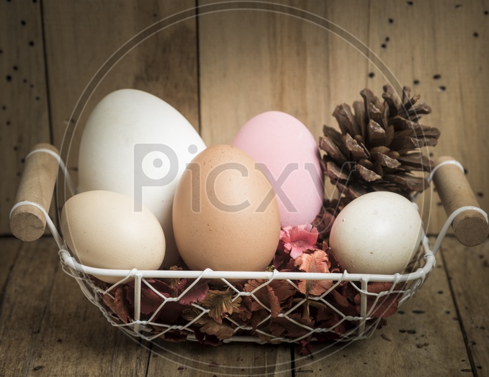 Hand Made Colorful Easter Eggs in a Basket