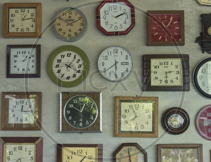 Closeup Of a Wall With Clocks Of Many Countries   Forming a Background