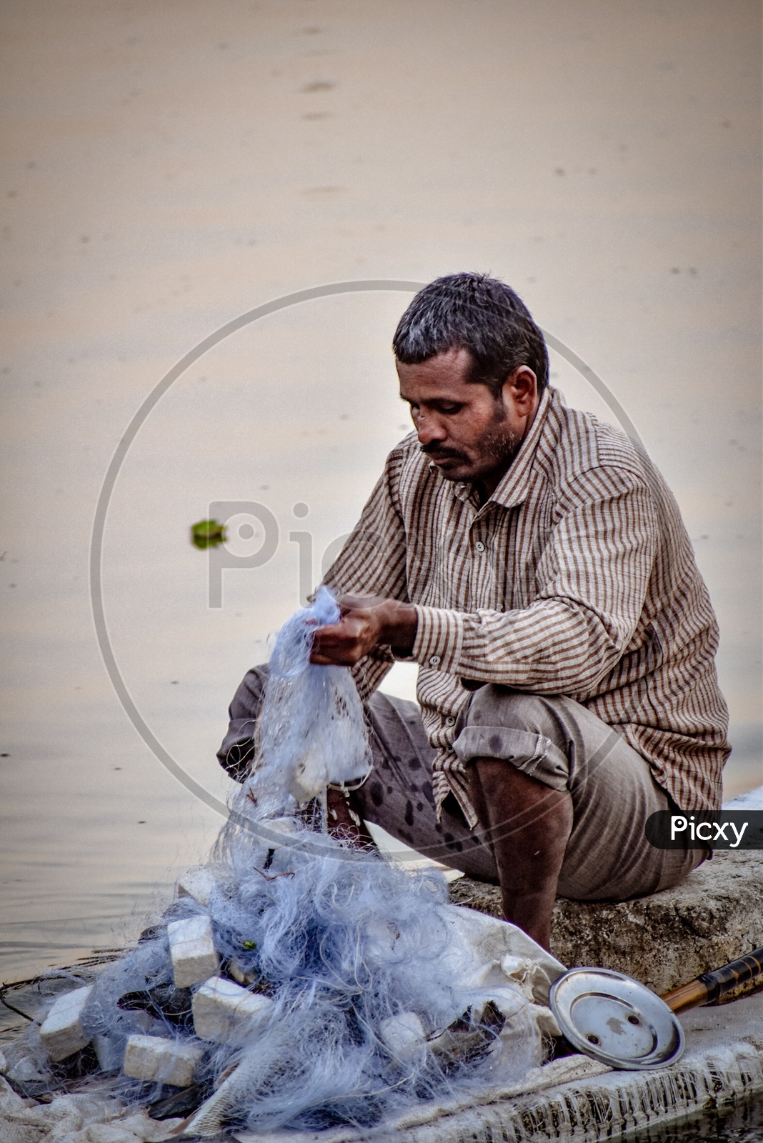 A Fisherman Doing His Daily Work