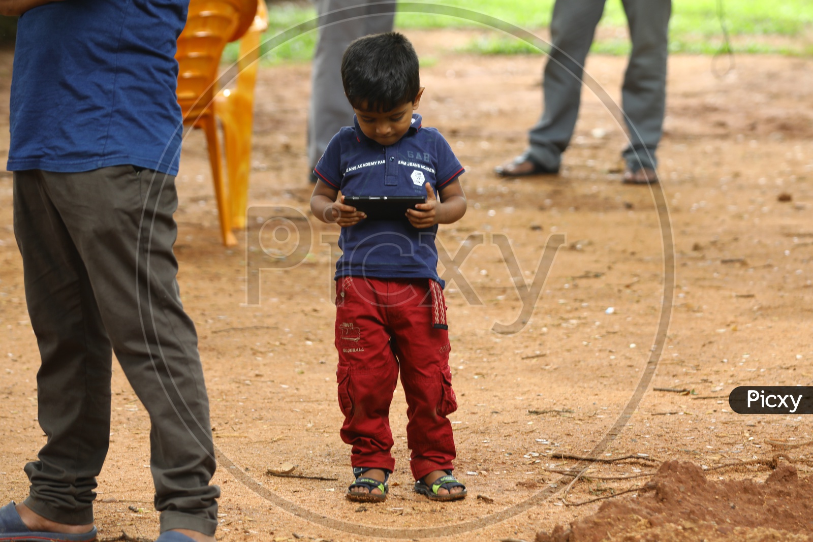 An Indian boy playing games in smartphone