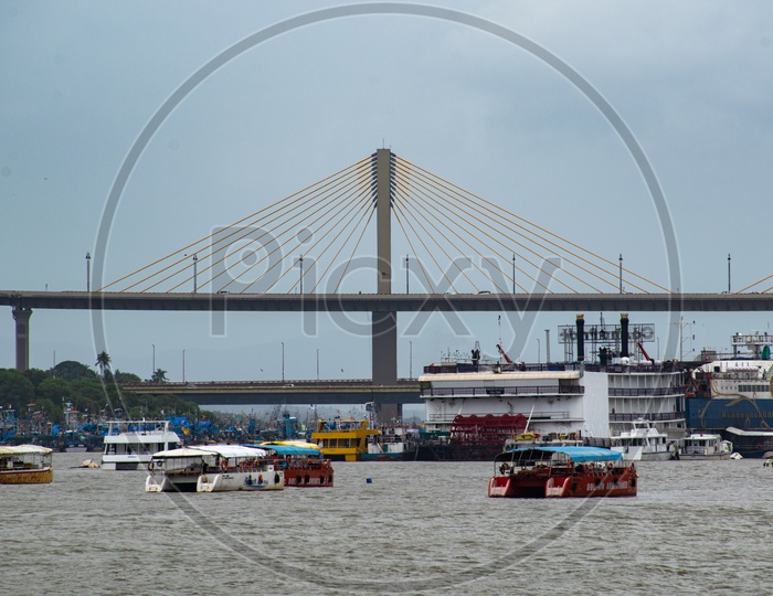 Cruise, boats, ships at Mandovi cable stayed bridge.
