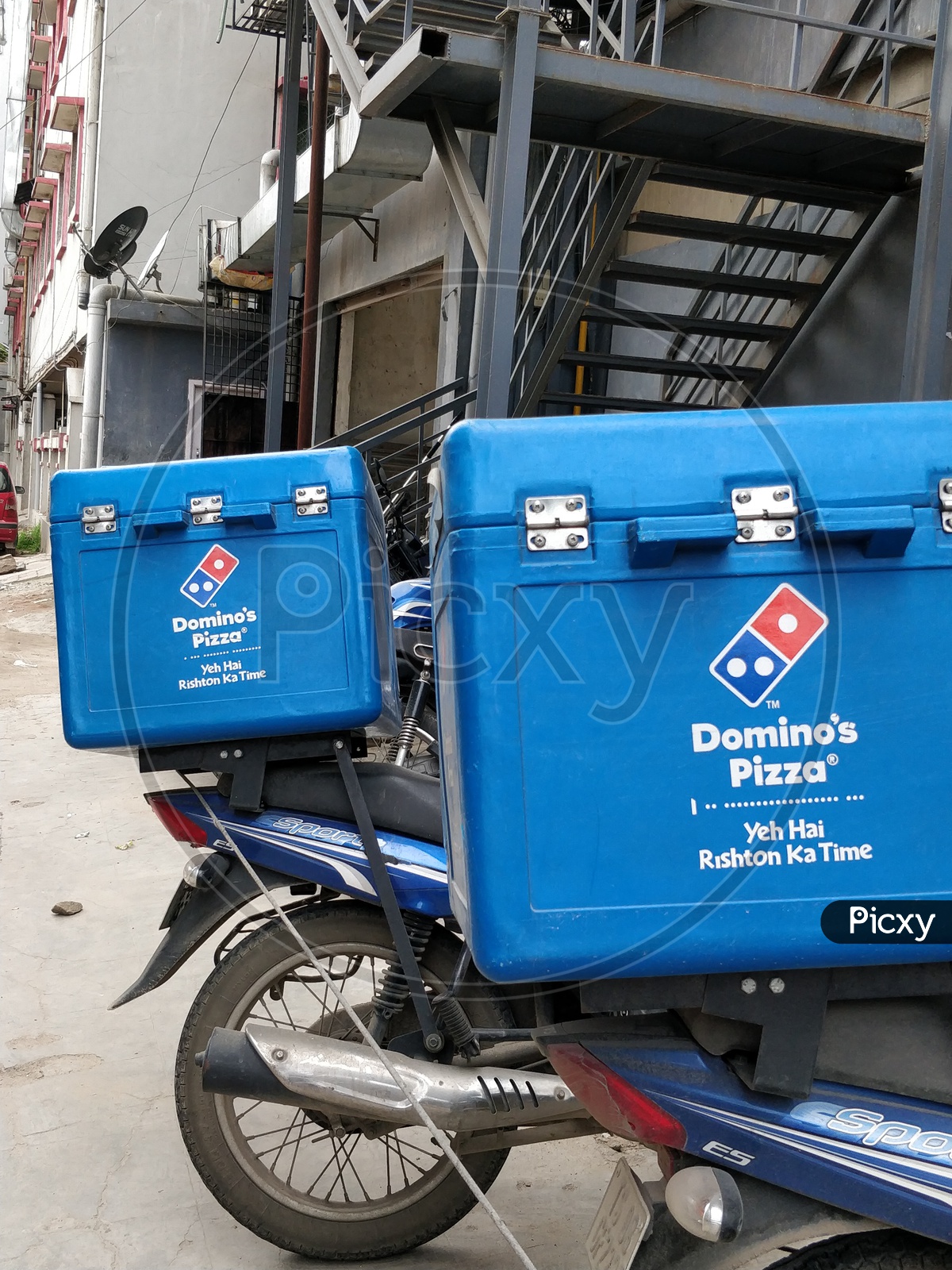 Domino's pizza delivery service boxes mounted on a bike/ motorcycle