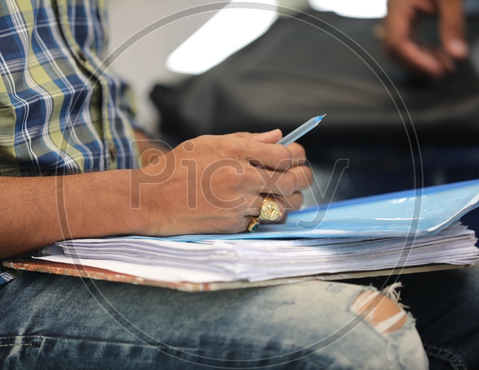 A Man holding a pen