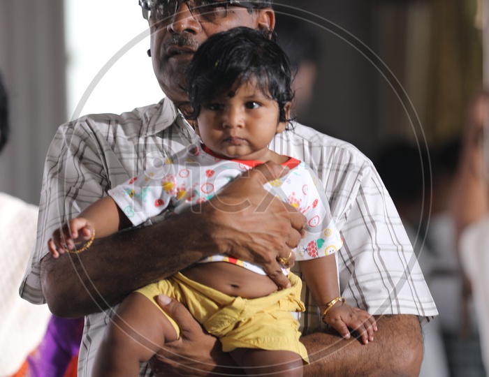 Indian Father holding his child