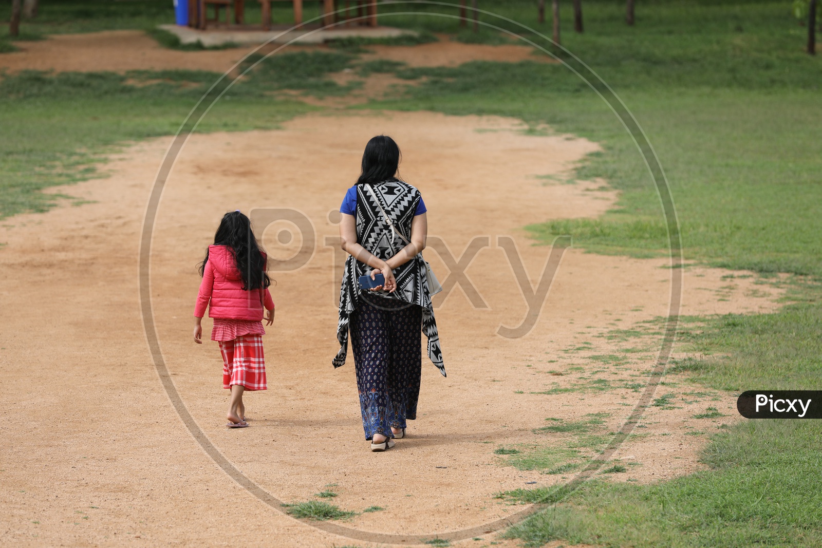 Indian Mother Walking with Her Daughter