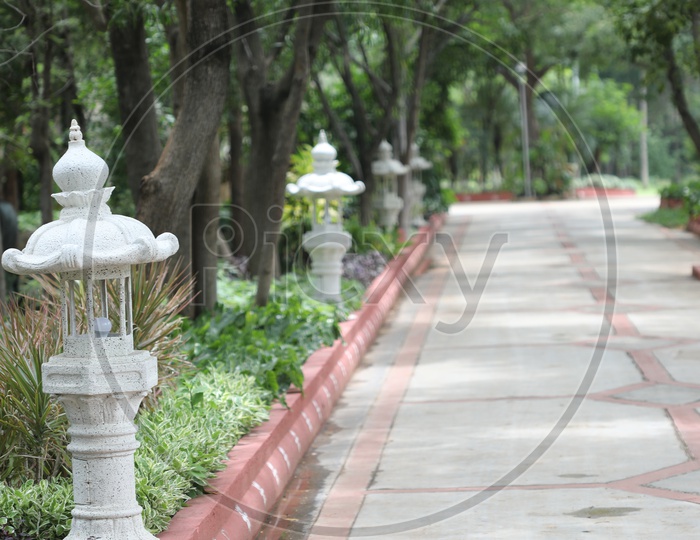 Roads Pathways With  Lamp Posts On Both Sides In a Park
