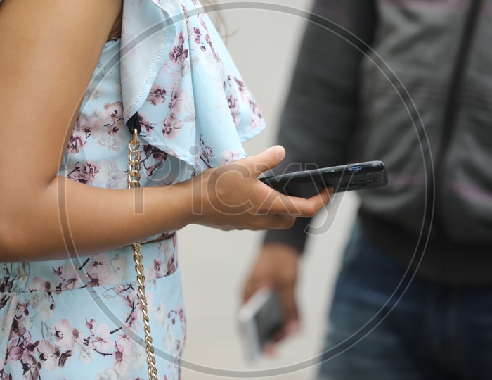 Young Indian Woman using Mobile or Smartphone