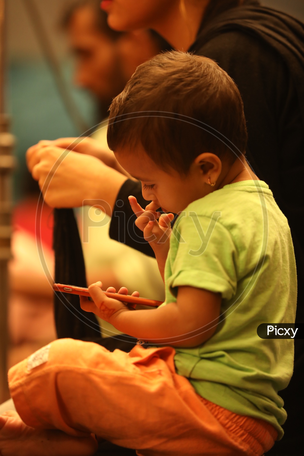 Indian Kid using Smartphone or Mobile
