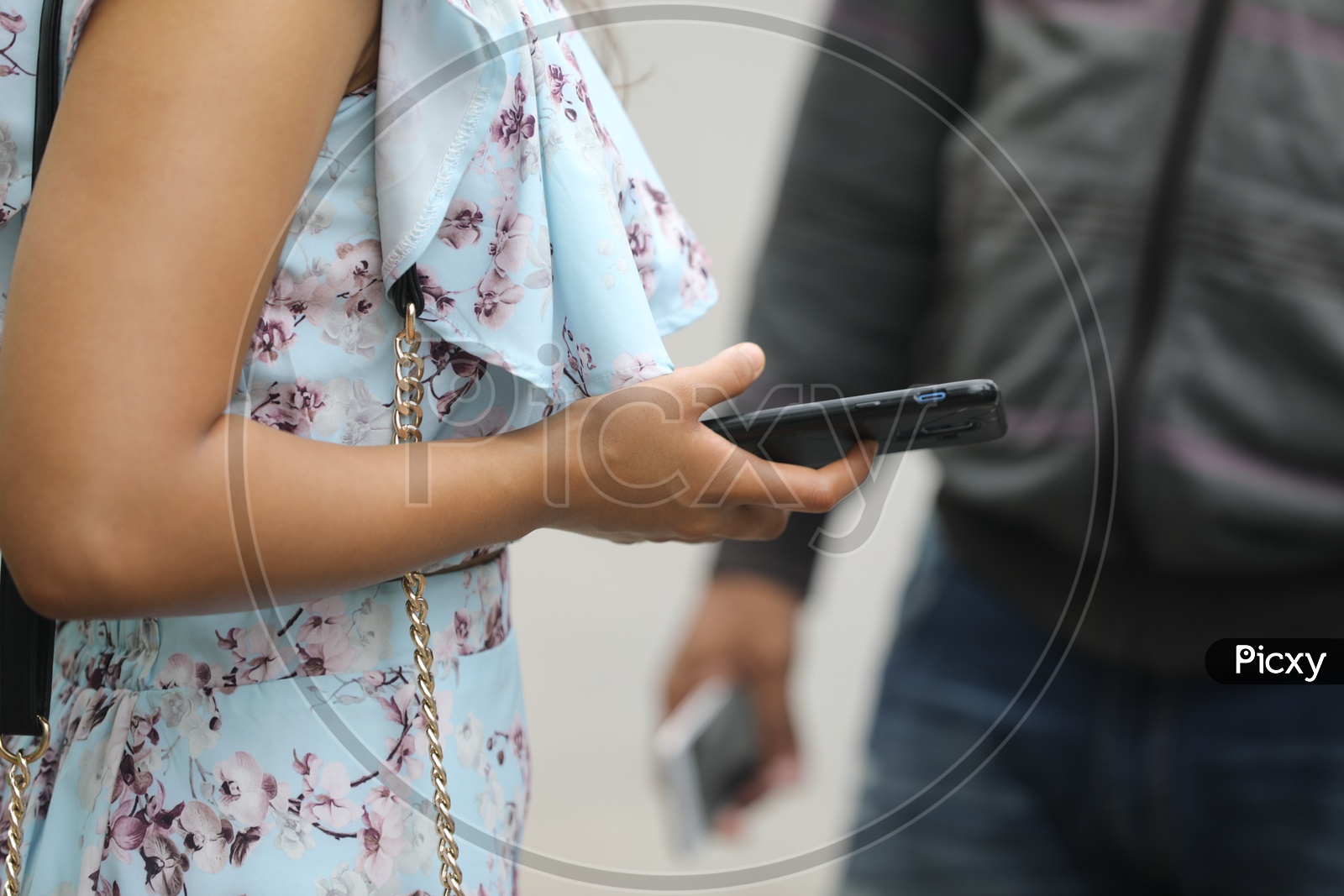 Young Indian Woman using Mobile or Smartphone
