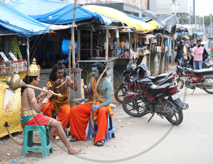 Indian Artists in Hindu God Dresses Sitting and Having Tea at a Road side Tea Stall