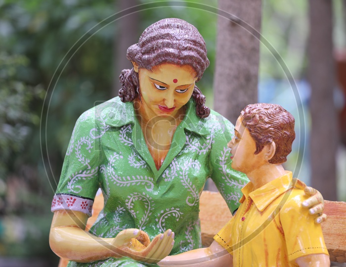 Statue Of a Mother and Son In a Park  Closeup