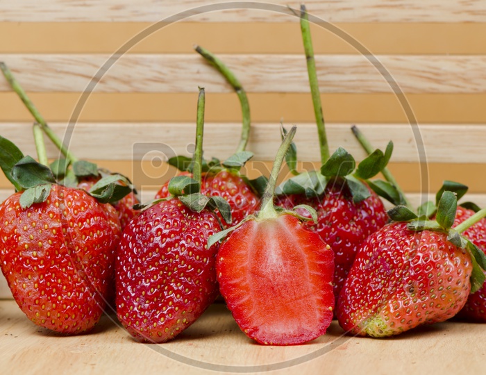 Delicious Strawberries on Wooden Background