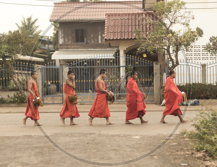 Buddhist monks on the streets of Luang Prabang, Laos