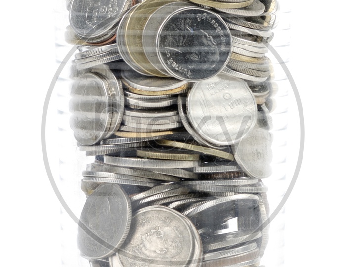 Coins in a Bowl  Over an Isolated White Background