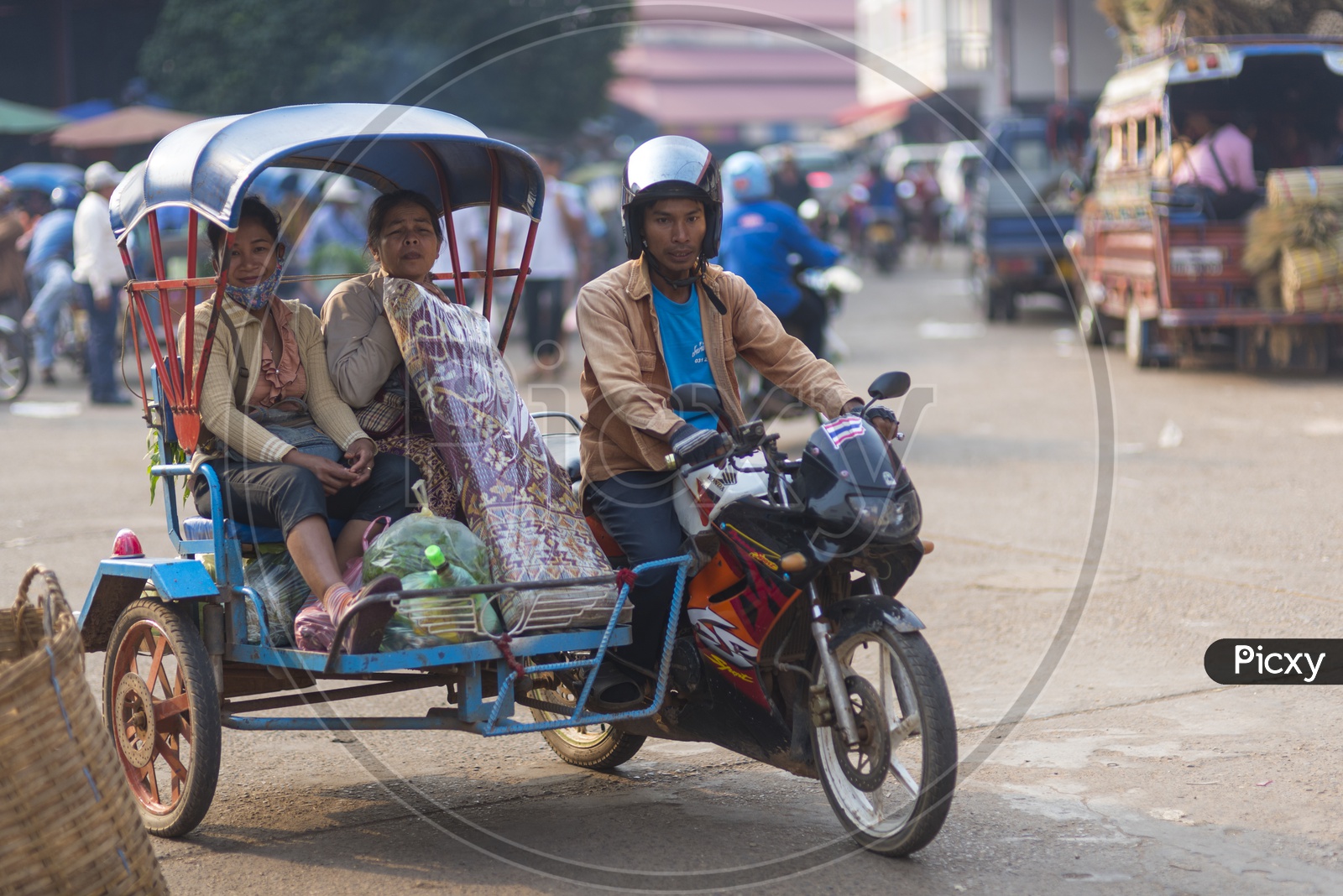 A Motorcycle Rickshaw Ride in  Luang Prabang Morning Market in Laos.