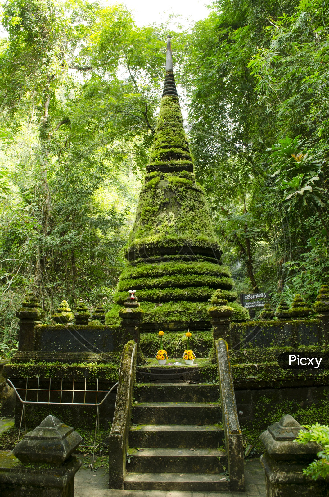 Old pagoda covered with moss at Phlio waterfall national park in Thailand