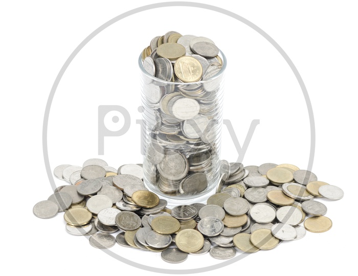 Coins in a Bowl On an Pile   Over an Isolated White Background