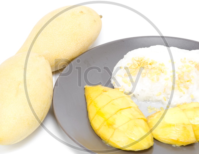 Thai dessert, Sweet mango with sticky rice mix with coconut milk Isolated on White Background