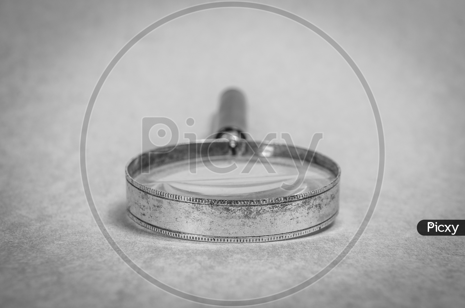 Authentic old metal magnifying glass in black and white