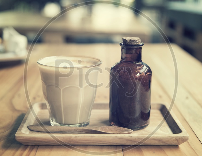 Coffee latte art in vintage filter