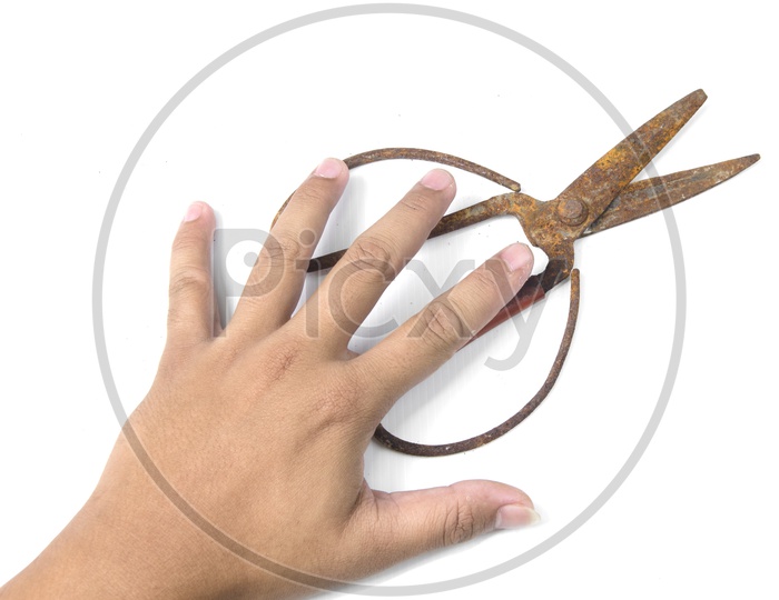 Old scissors in boy's hand