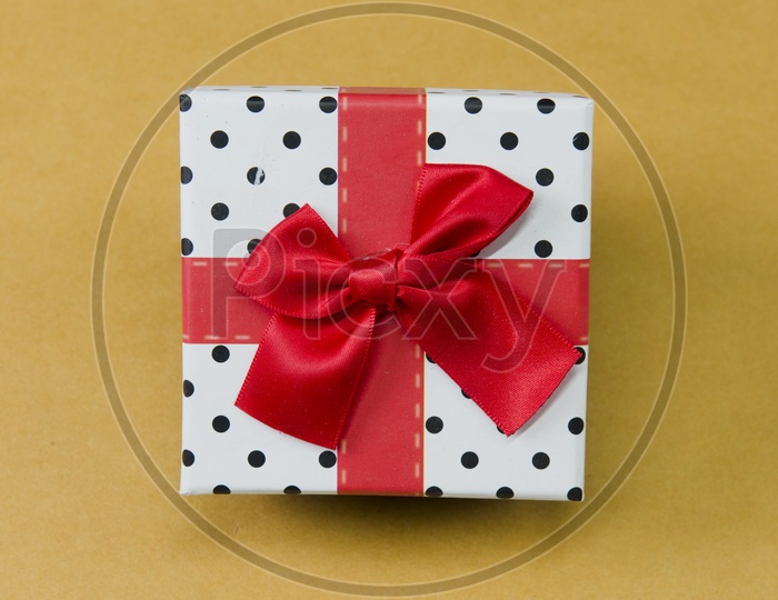 A Ribbon wrapped polka dots gift box
