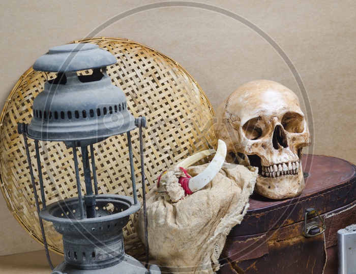 Still life with human skull and lantern