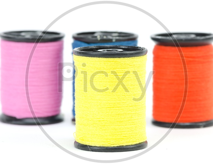 Colourful Sewing Thread Rolls Isolated Over an White Background