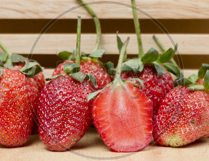 Yummy Strawberries on Wooden Background
