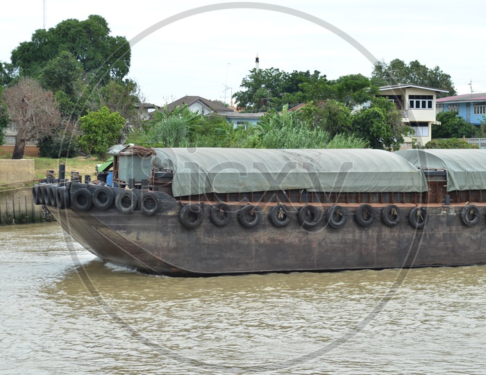 A Thai Cargo ship moving on the river