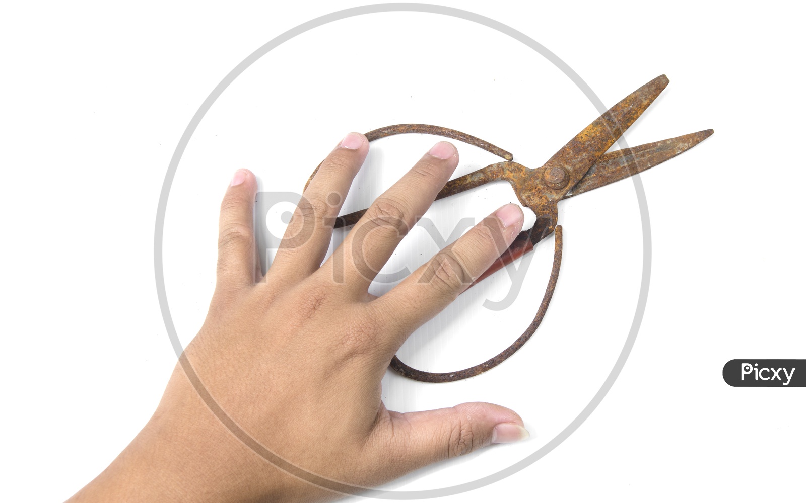 Old scissors in boy's hand