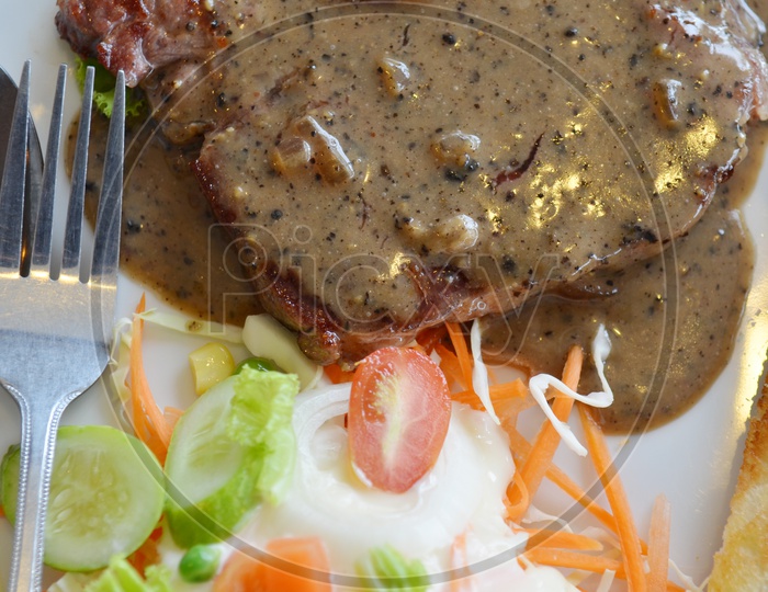 Grilled beef steak Served with Fresh Salad
