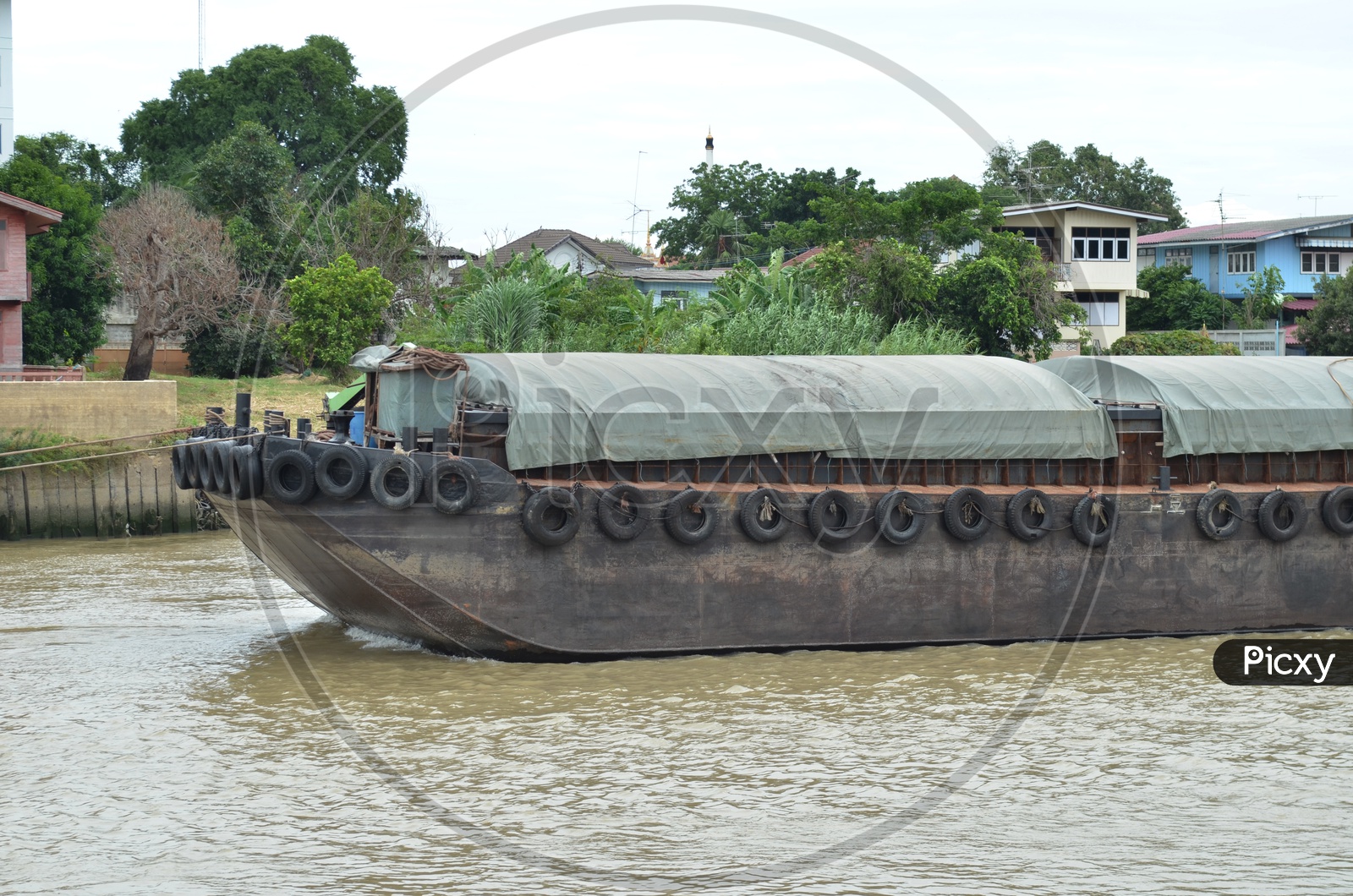 A Thai Cargo ship moving on the river