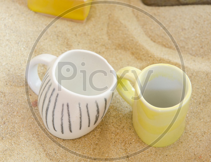 ceramic Cups Over a sand
