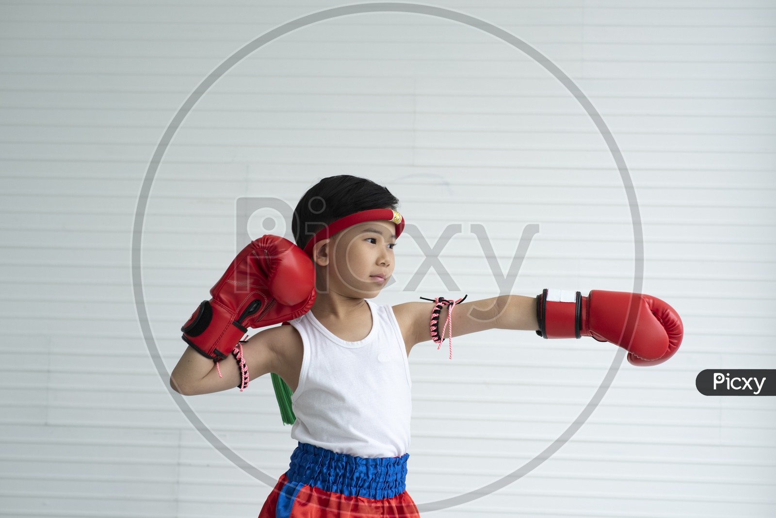A Thai child learning boxing