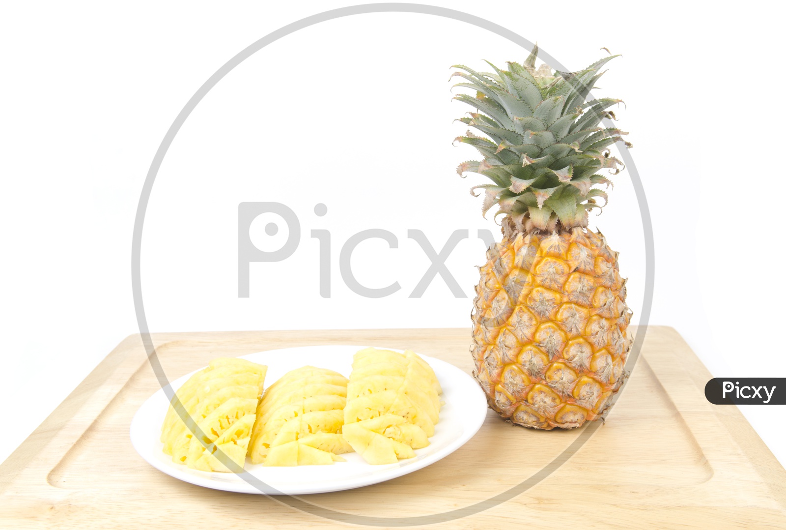 Pineapple Slices in a plate isolated over white background