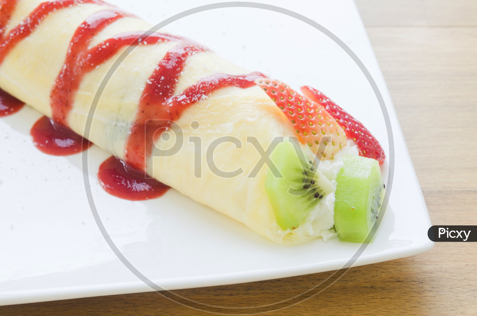 Crepes With Berries and kiwi. Crepe with Strawberry, Raspberry, Blueberry and Chocolate topping. Pancake