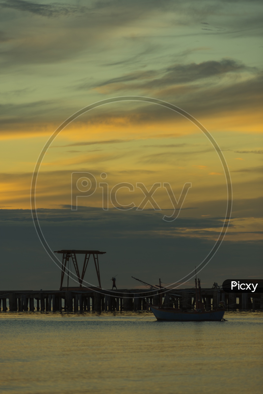 A Sea Pier with Beautiful Sunset in Sky Background