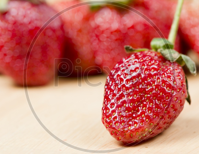 Delicious Strawberries on Wooden Background