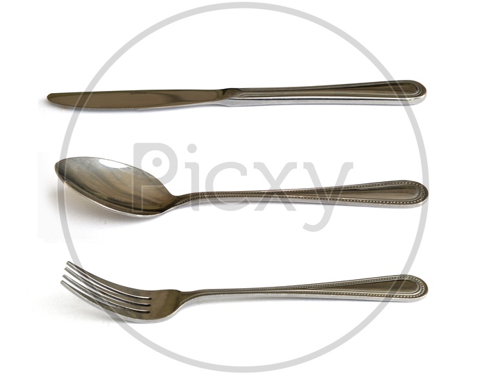 Cutlery: spoon, knife, fork. Isolated on white background