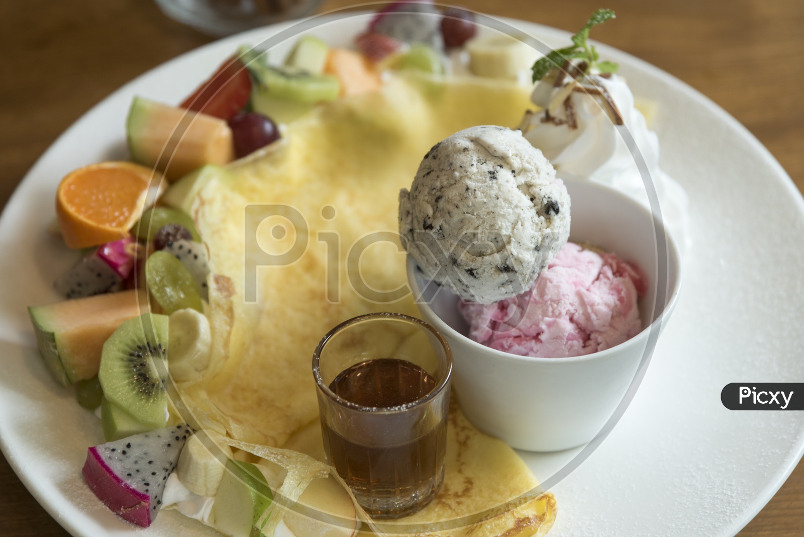 Crepe with ice cream served in a plate