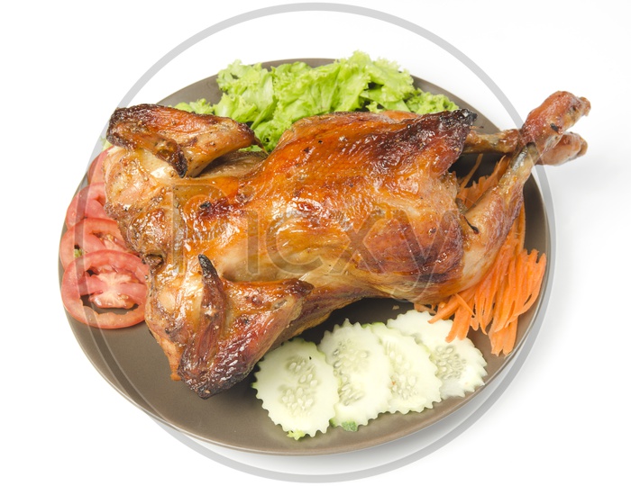 whole grilled chicken served with vegetable