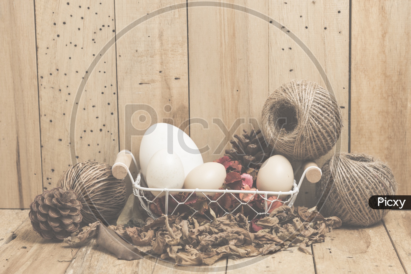 Easter eggs on wooden background, vintage filtered Images