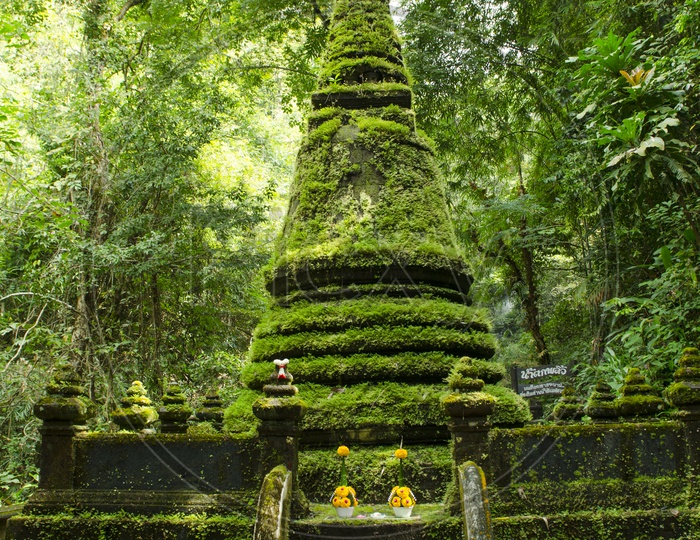 Old pagoda covered with moss at Phlio waterfall national park in Thailand
