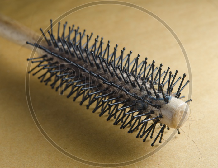 A Black comb with hair loss